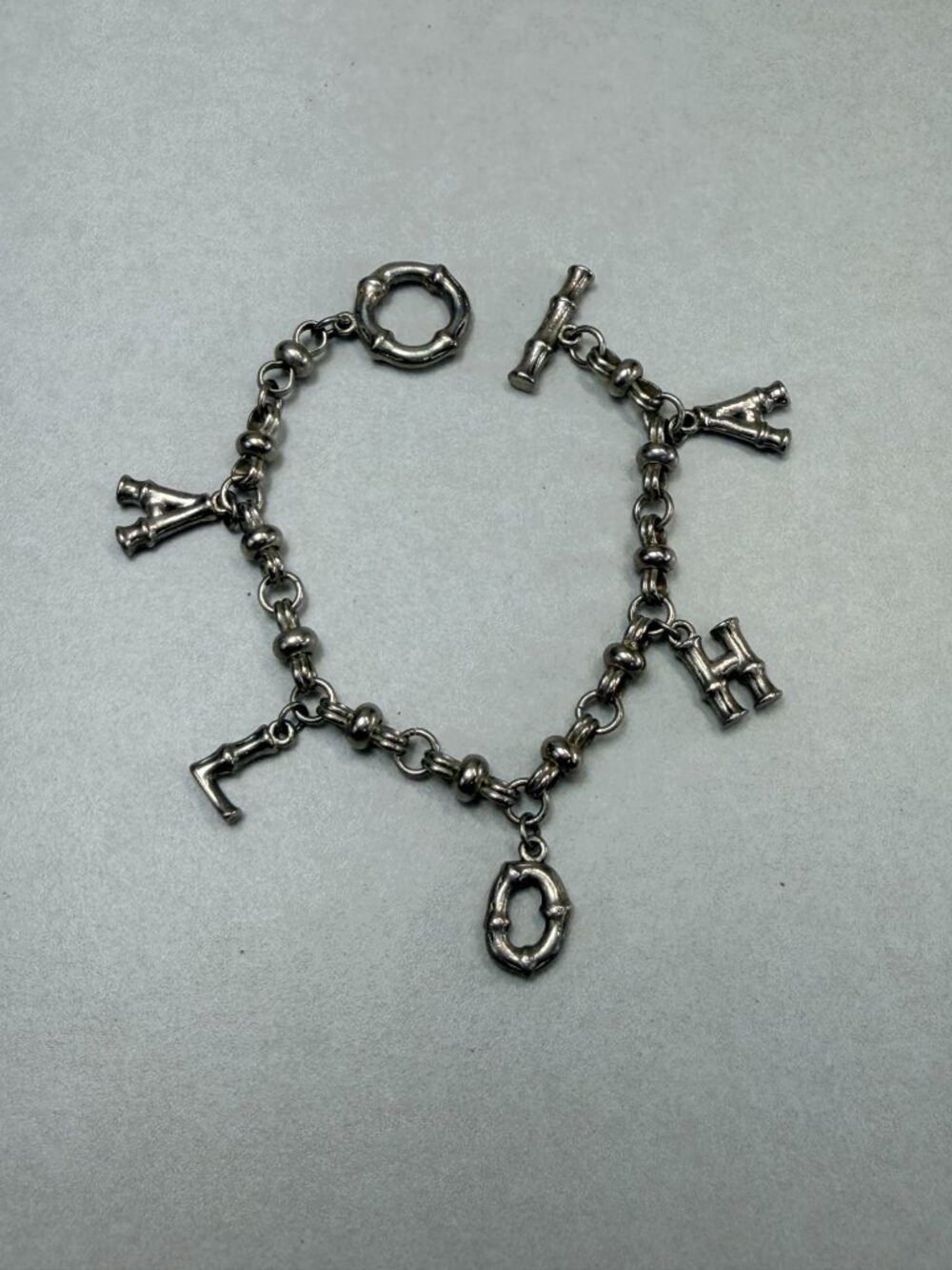 Silver tone Aloha Bamboo Charm Bracelet 7.5" Toggle Clasp
